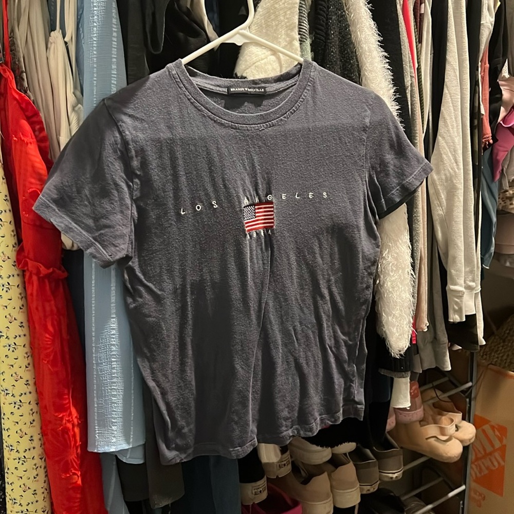 One size fits all brandy melville t-shirt. Navy blue, says Los Angeles 1984